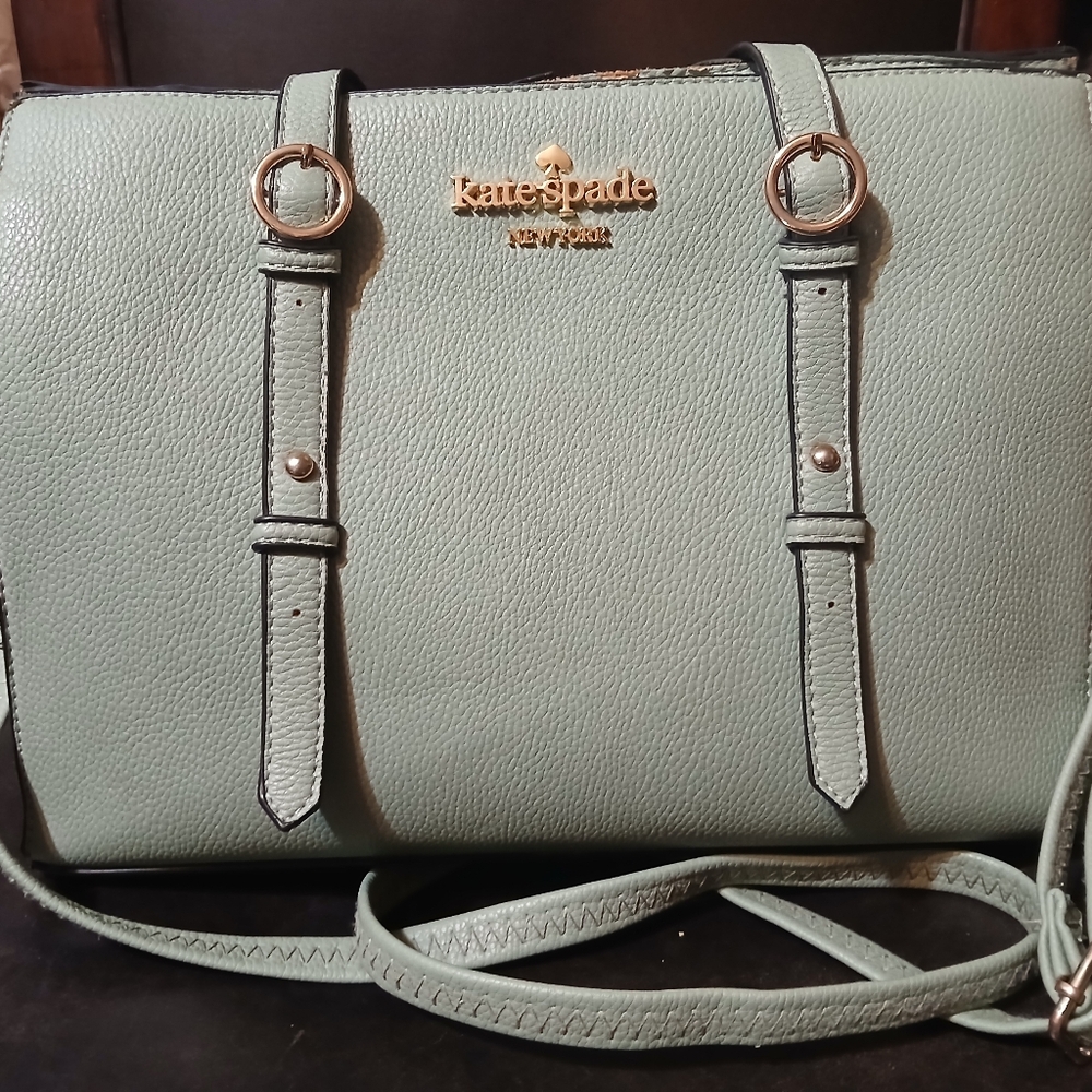 Well-loved, well-used Kate Spade Mint Green triple gusset crossbody bag